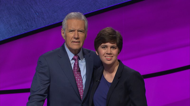 Emma Boettcher smiling with Alex Trebek.