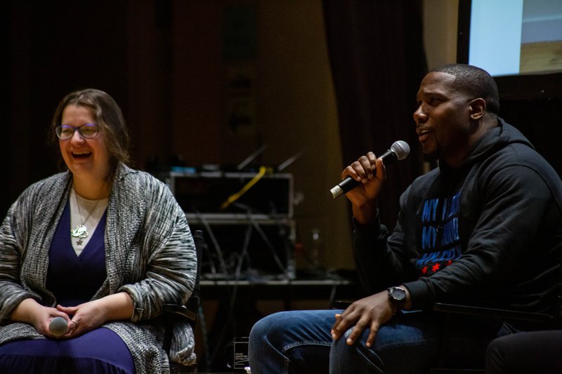 Jahmal Cole speaking into a microphone